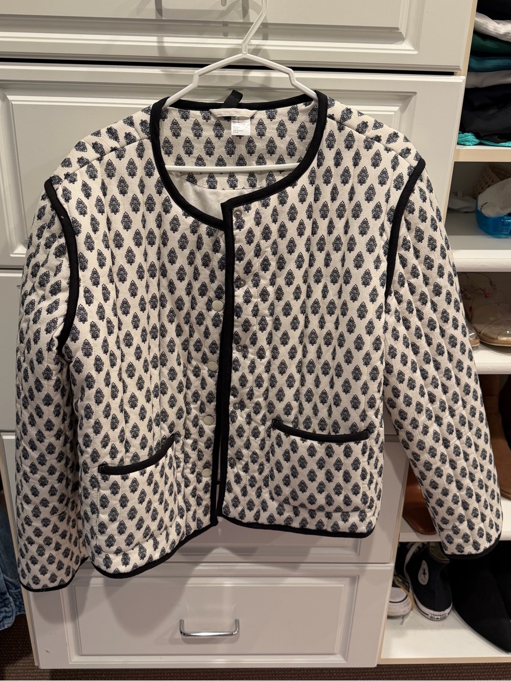 H&M Cream Quilted Jacket with Black Trim and Leaf Motif